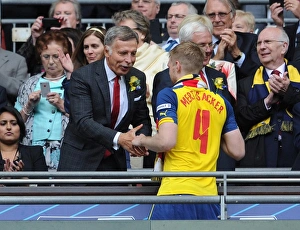 Arsenal Director Stan Kroenke shakes hands with Per Mertesacker (Arsenal) after the match Arsenal Director Stan Kroenke shakes hands with Per Mertesacker (Arsenal) after the match