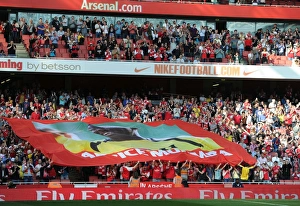 Arsenal fans with a banner to support former player Fabrice Muamba who collapsed whilst Arsenal fans with a banner to support former player Fabrice Muamba who collapsed whilst