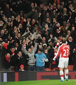 Images Dated 20th January 2010: Arsenal fans celebrate the 4th goal score by Andrey Arshavin. Arsenal 4