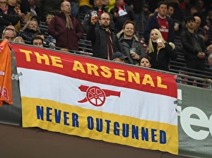 Arsenal fans flags in the stadium before the match. FC Koln 1:0 Arsenal. UEFA Europa Cup Arsenal fans flags in the stadium before the match. FC Koln 1:0 Arsenal. UEFA Europa Cup