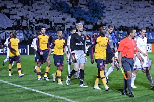 The Arsenal and Kiev teams walk onto the pitch before the match The Arsenal and Kiev teams walk onto the pitch before the match