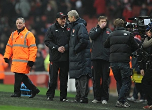 Arsenal manager Arsene Wenger shakes with Orient manager Russell Slade Arsenal manager Arsene Wenger shakes with Orient manager Russell Slade