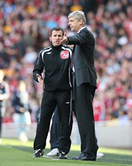 Arsenal manager Arsene Wenger talks with the 4th Official Arsenal manager Arsene Wenger talks with the 4th Official