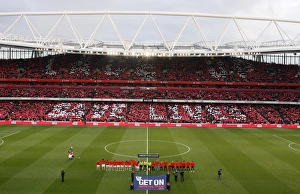 The Arsenal and Manchester United teams walk out onto the pitch with the Nike Lace Up The Arsenal and Manchester United teams walk out onto the pitch with the Nike Lace Up