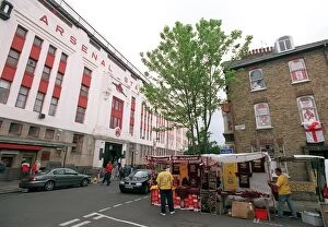 Highbury Stadium Collection: Arsenal Stadium with a house on Conewood Street with Arsenal posters in the windows