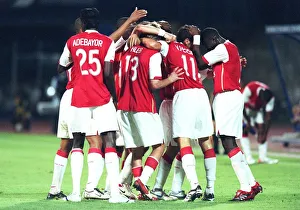 The Arsenal team celebrate the 2nd goal, scored by Robin van Persie The Arsenal team celebrate the 2nd goal, scored by Robin van Persie