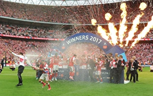 The Arsenal team celebrate with the traophy after the match. Arsenal 2:1 Chelsea The Arsenal team celebrate with the traophy after the match. Arsenal 2:1 Chelsea