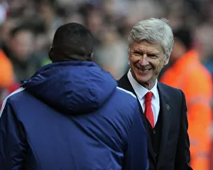 Arsene Wenger the Arsenal Manager with Guy Demel (West Ham) before the match. Arsenal 3 Arsene Wenger the Arsenal Manager with Guy Demel (West Ham) before the match. Arsenal 3