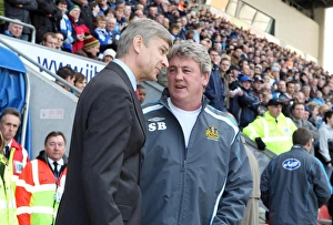 Arsene Wenger the Arsenal Manager speaks to Steve Bruce the Wigan Manager before the match Arsene Wenger the Arsenal Manager speaks to Steve Bruce the Wigan Manager before the match