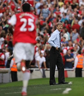 Arsene Wenger watches Emmanuel Adebayor celebrate scoring Arsenals 2nd goal his 1st Arsene Wenger watches Emmanuel Adebayor celebrate scoring Arsenals 2nd goal his 1st