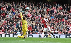 Images Dated 9th May 2010: Carlos Vela chips the ball over Fulham goalkeeper Mark Schwarzer to score the 4th Arsenal goal