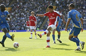 Carlos Vela shoots past Portsmouth goalkeeper David Carlos Vela shoots past Portsmouth goalkeeper David