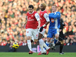 Cesc Fabregas and Alex Song (Arsenal) Ben Watson (Wigan) with mascots and officials before the match. Arsenal 3:0 Wigan Athletic. Barclays Premier League, Emirates Stadium, Arsenal Football Club, London, 22/1/2011. Credit : Stuart MacFarlane / Arsenal Cesc Fabregas and Alex Song (Arsenal) Ben Watson (Wigan) with mascots and officials before the match. Arsenal 3:0 Wigan Athletic. Barclays Premier League, Emirates Stadium, Arsenal Football Club, London, 22/1/2011. Credit : Stuart MacFarlane / Arsenal