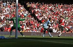 Images Dated 25th August 2007: Cesc Fabregas scores Arsenals goal past Micah Richards and Casper Schmeichel
