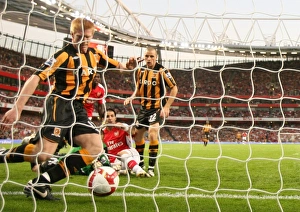 Cesc Fabregas scores Arsenals goal under pressure from Paul McShane Cesc Fabregas scores Arsenals goal under pressure from Paul McShane