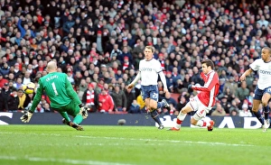 Cesc Fabregas shoots past Aston Villa goalkeeper Brad Friedel to score the 2nd Arsenal Cesc Fabregas shoots past Aston Villa goalkeeper Brad Friedel to score the 2nd Arsenal
