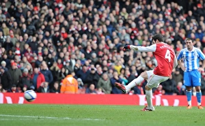 Cesc Fabregas shoots past Huddersfield goalkeeper Ian Bennett from the penalty spot to Cesc Fabregas shoots past Huddersfield goalkeeper Ian Bennett from the penalty spot to