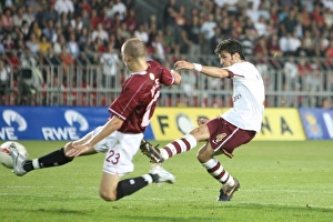 Cesc Fabregas shoots past Sparta goalkeeper Tomas Postulka to score the 1st Arsenal goal Cesc Fabregas shoots past Sparta goalkeeper Tomas Postulka to score the 1st Arsenal goal