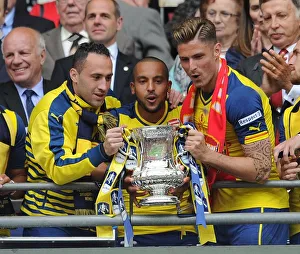 David Ospina, Theo Walcott and Olivier Giroud (Arsenal) lift the FA Cup after the match David Ospina, Theo Walcott and Olivier Giroud (Arsenal) lift the FA Cup after the match