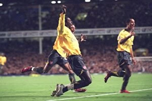 Images Dated 9th November 2006: Emmanuel Adebayor celebrates scoring Arsenals goal with Armand Traore