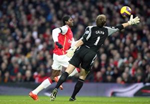 Emmanuel Adebayor rounds Robert Green (West Ham) on his way to scoring Arsenals 2nd goal Emmanuel Adebayor rounds Robert Green (West Ham) on his way to scoring Arsenals 2nd goal