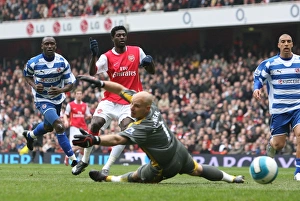 Emmanuel Adebayor shoots past Reading goalkeeper Marcus Hahnemann to score the 1st Emmanuel Adebayor shoots past Reading goalkeeper Marcus Hahnemann to score the 1st