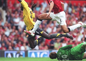 Emmanuel Adebayor is tripped by Manchester United goalkeeper Tomaz Kuszczak for the Emmanuel Adebayor is tripped by Manchester United goalkeeper Tomaz Kuszczak for the