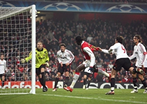Emmanuel Adebayors header hits the crossbar as AC Milan goalkeeper Zeljko Kalac looks on Emmanuel Adebayors header hits the crossbar as AC Milan goalkeeper Zeljko Kalac looks on