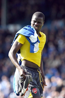 Emmanuel Eboue (Arsenal) gives his boots to a fan after the match Emmanuel Eboue (Arsenal) gives his boots to a fan after the match