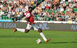 Emmanuel Eboue shoots past Leiga goalkeeper Kostyantyn Makhnovskyy to score the 3rd Emmanuel Eboue shoots past Leiga goalkeeper Kostyantyn Makhnovskyy to score the 3rd