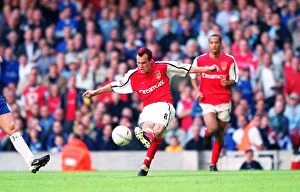 Images Dated 7th April 2005: Fredrik Ljungberg shoots past Chelsea goalkeeper Carlo Cudicini to score the 2nd Arsenal goal