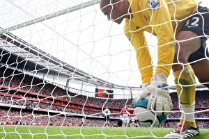 Fulham goalkeeper Tony Warner picks the ball out of the net after Robin van Persie' Fulham goalkeeper Tony Warner picks the ball out of the net after Robin van Persie'
