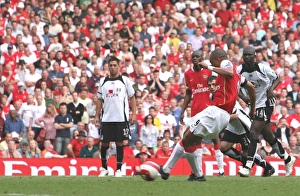 Gilberto shoots past Fulham goalkeeper Antti Niemi to score the 3rd Arsenal goal from Gilberto shoots past Fulham goalkeeper Antti Niemi to score the 3rd Arsenal goal from