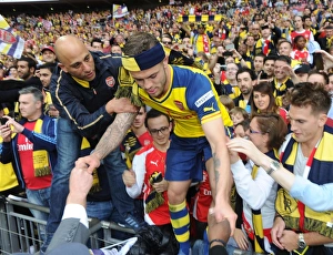 Jack Wilshere (Arsenal) climbs out of the crowd. Arsenal 4:0 Aston Villa. FA Cup Final Jack Wilshere (Arsenal) climbs out of the crowd. Arsenal 4:0 Aston Villa. FA Cup Final