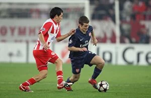 Images Dated 9th December 2009: Jack Wilshere (Arsenal) Luciano Galletti (Olympiacos). Olympiacos 1: 0 Arsenal