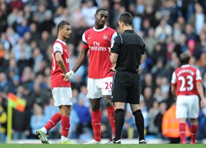 Johan Djourou (Arsenal) is booked by Mark Clattebnburg. Manchester City 0:3 Arsenal Johan Djourou (Arsenal) is booked by Mark Clattebnburg. Manchester City 0:3 Arsenal