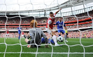 Laurent Koscielny shoots past Bolton goalkeeper Adam Bogdan to score the 1st Arsenal goal Laurent Koscielny shoots past Bolton goalkeeper Adam Bogdan to score the 1st Arsenal goal