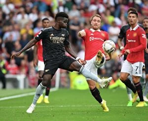 Manchester United F Collection: Manchester United vs Arsenal: Bukayo Saka vs Christian Eriksen Clash in the 2022-23 Premier League