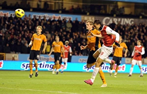 Marouane Chamakh heads past Wolves goalkeeper Marcus Hahnemann to score the 1st Arsenal Marouane Chamakh heads past Wolves goalkeeper Marcus Hahnemann to score the 1st Arsenal