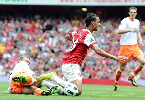 Marouane Chamakh is tripped by Blackpool defender Ian Evatt for the Arsenal penalty Marouane Chamakh is tripped by Blackpool defender Ian Evatt for the Arsenal penalty