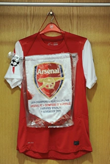 Match pennant hangs with the captains shirt. Arsenal 0:0 Marseille. UEFA Champions League Match pennant hangs with the captains shirt. Arsenal 0:0 Marseille. UEFA Champions League