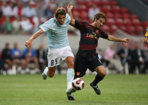 Mathieu Flamini (Arsenal) Valon Behrami (Lazio) Mathieu Flamini (Arsenal) Valon Behrami (Lazio)