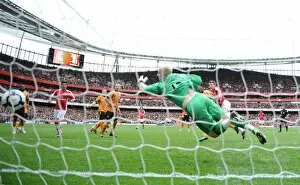 Images Dated 3rd April 2010: Nicklas Bendtner heads past Wolves goalkeeper Marcus Hahnemann to score the Arsenal goal