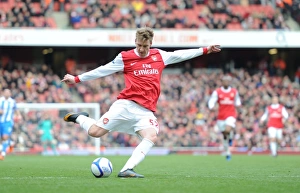 Nicklas Bendtner shoots past Huddersfield goalkeeper Ian Bennett to score the 1st Arsenal Nicklas Bendtner shoots past Huddersfield goalkeeper Ian Bennett to score the 1st Arsenal