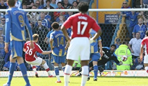 Nicklas Bendtner shoots past Portsmouth goalkeeper Nicklas Bendtner shoots past Portsmouth goalkeeper