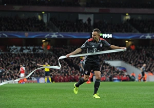 Rafina (Bayern) clears paper from the pitch thrown on by the Bayern fans. Arsenal 1 Rafina (Bayern) clears paper from the pitch thrown on by the Bayern fans. Arsenal 1