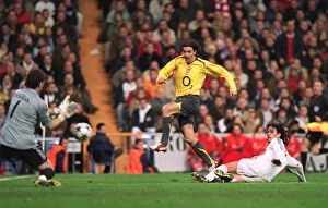 Images Dated 22nd February 2006: Robert Pires (Arsenal) has his shot saved by Iker Casillas as Perez Mejia