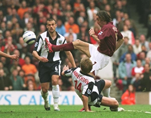 Robert Pires shoots past West Brom goalkeeper Tomasz Kuszczak to score the 2nd Arsenal Robert Pires shoots past West Brom goalkeeper Tomasz Kuszczak to score the 2nd Arsenal