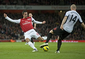 Robin van Persie of Arsenal breaks shoots Philippe Senderos of Fulham during the Barclays Robin van Persie of Arsenal breaks shoots Philippe Senderos of Fulham during the Barclays