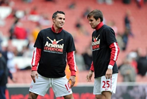 Robin van Persie and Carl Jenkinson (Arsenal) warm up in thier Arsenal for Everyone T Robin van Persie and Carl Jenkinson (Arsenal) warm up in thier Arsenal for Everyone T